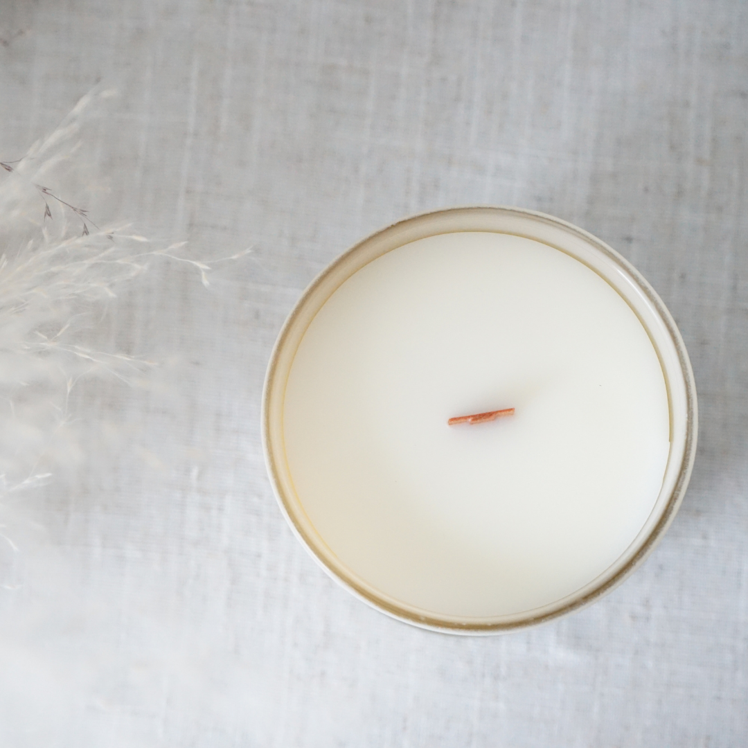 coconut soy candle in a decorative glass jar